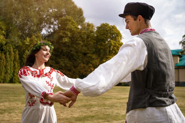 Young adults having fun while folk dancing