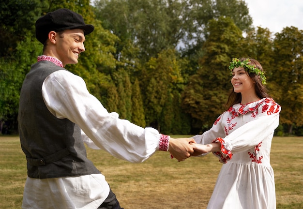 Free photo young adults having fun while folk dancing