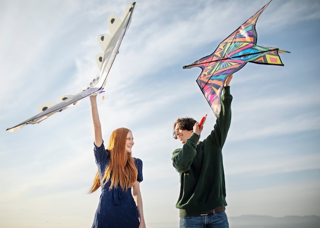 Free photo young adults having fun with kite