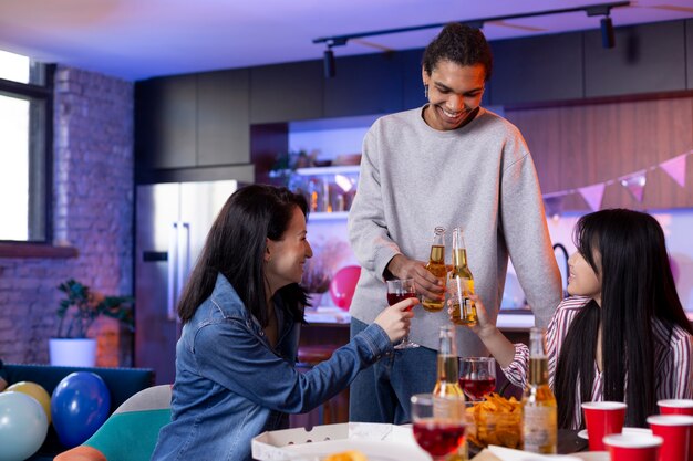 Young adults having a party at home