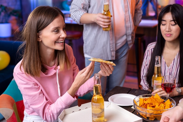 Young adults having a party at home