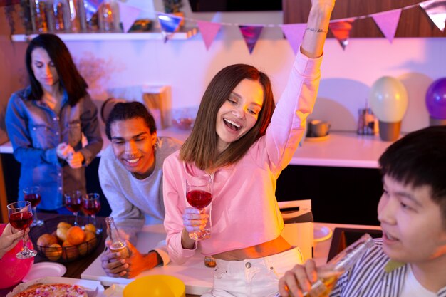 Young adults having a party at home