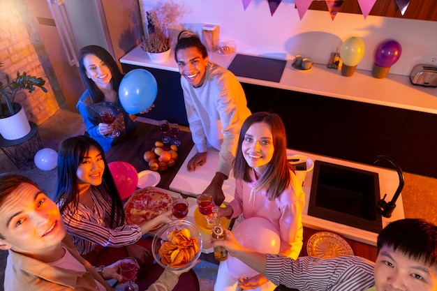 Young adults having a party at home