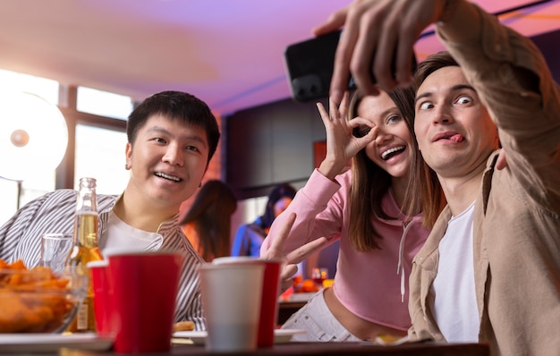 Young adults having a party at home