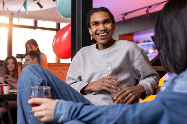 Young adults having a party at home