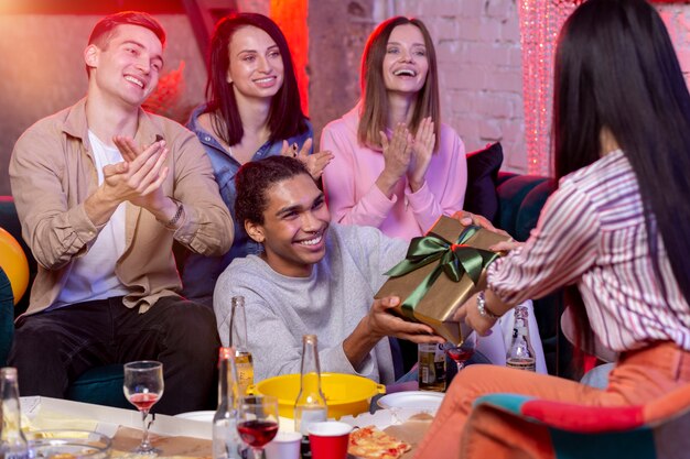 Young adults having a party at home