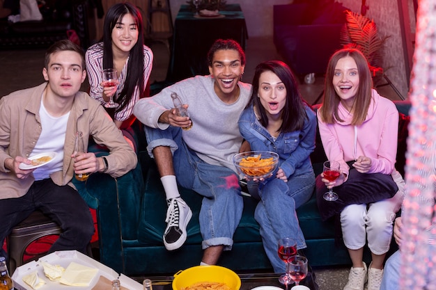 Young adults having a party at home