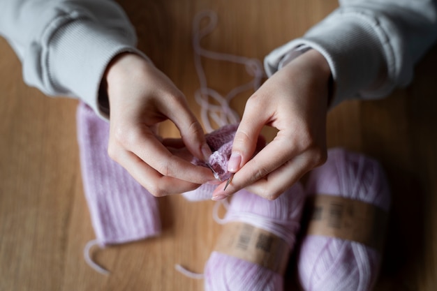 Young adults knitting outside