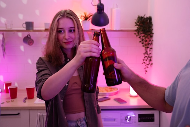 Young adults playing beer pong