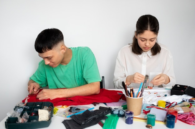 Young adults reusing fabric material