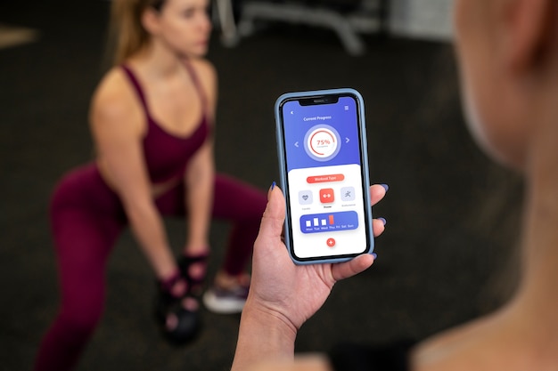 Young adults in sport gym using kettlebells