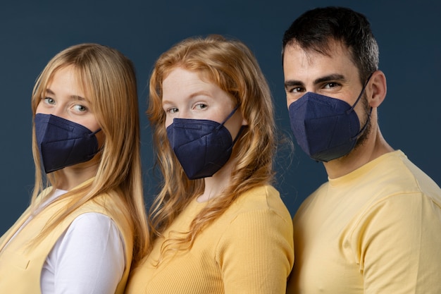 Free photo young adults wearing face mask