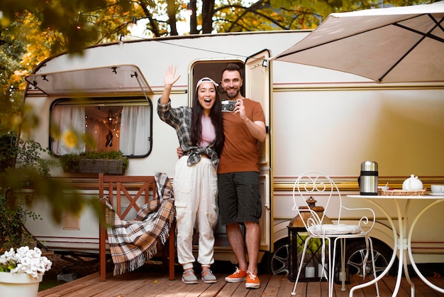 Young adventurous couple and their van