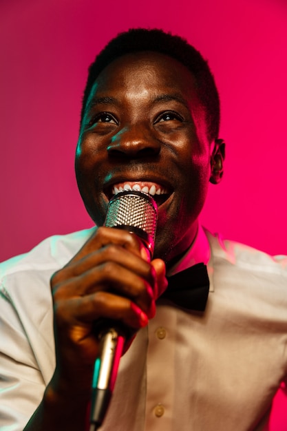 Free photo young african-american jazz musician singing a song