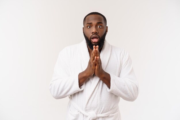 Young african american man in bathrobe screaming proud and celebrating victory and success very excited cheering emotion