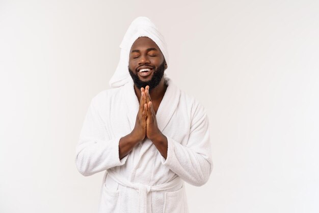 Free photo young african american man in bathrobe screaming proud and celebrating victory and success very excited cheering emotion