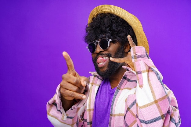 Young african american man doing talking on the telephone gesture