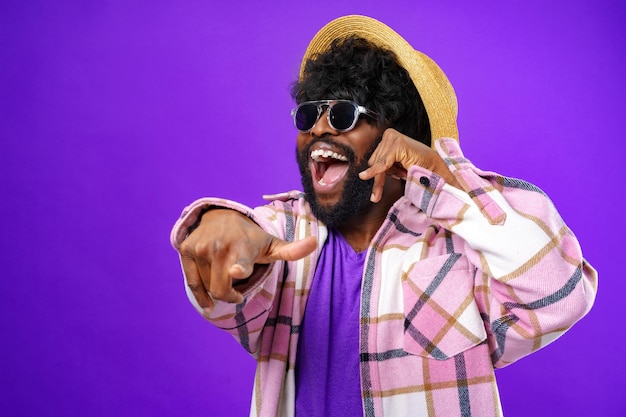 Young african american man doing talking on the telephone gesture