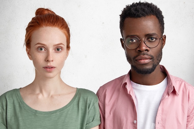 Young African-American man and red-haired woman