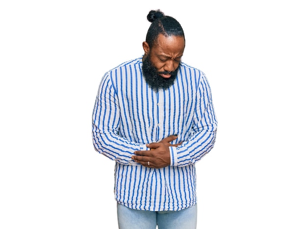 Free photo young african american man wearing business shirt with hand on stomach because indigestion, painful illness feeling unwell. ache concept.