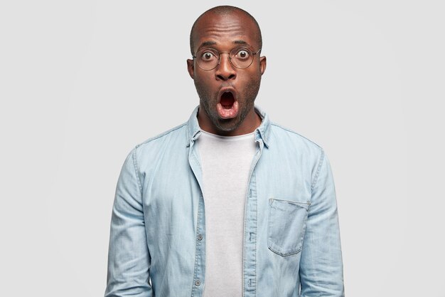 Young African American man wearing denim shirt