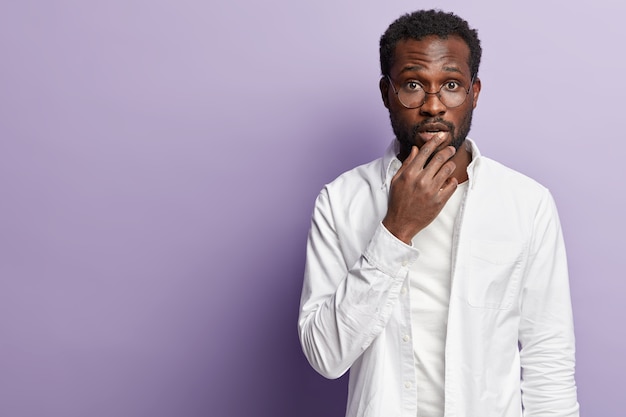 Young African American man wearing white shirt