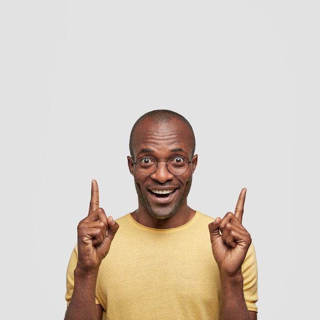 Young African American man wearing yellow T-shirt