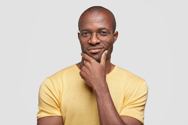 Young African American man wearing yellow T-shirt