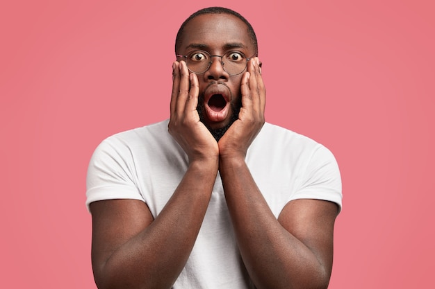 Young african-american man with round glasses