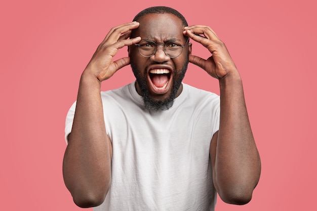 Young African-American man with round glasses