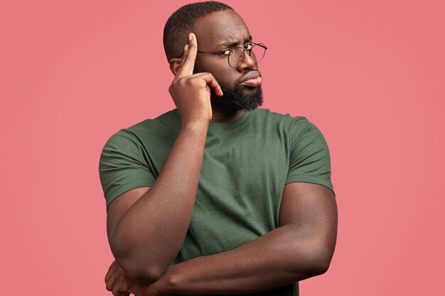 Young African-American man with round glasses