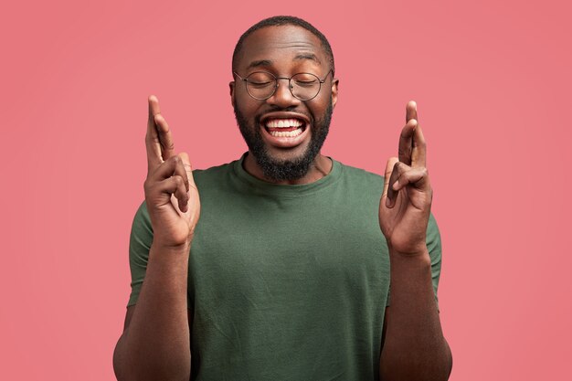 Young African-American man with round glasses