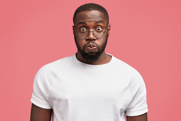 Young African-American man with round glasses