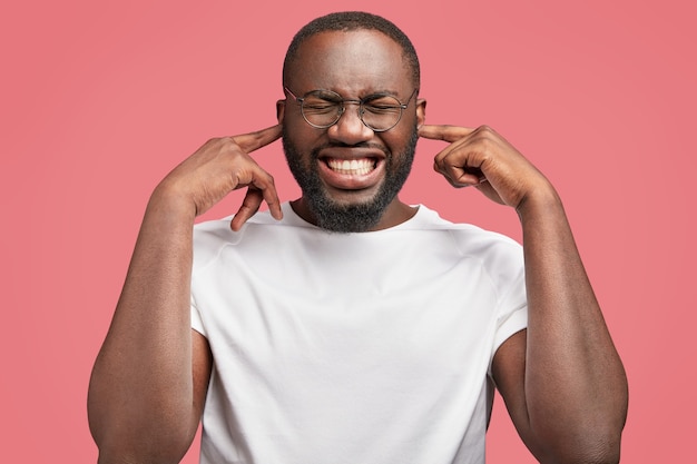 Young African-American man with round glasses