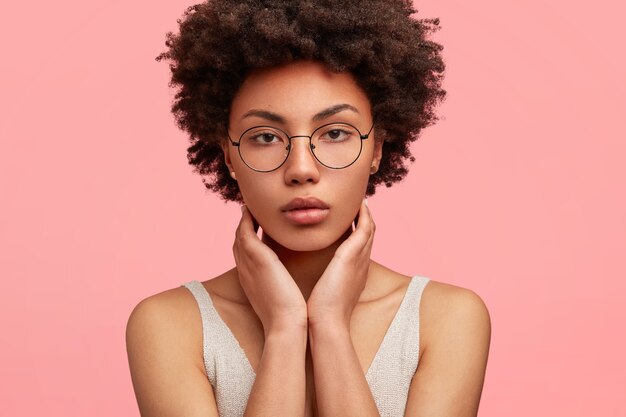 Young African-American woman wearing round eyeglasses