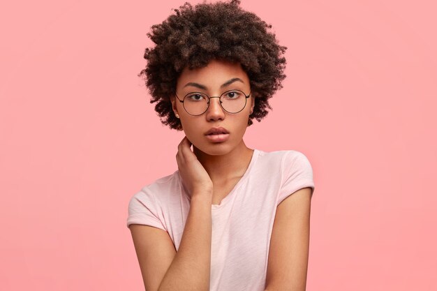 Young African-American woman wearing round glasses