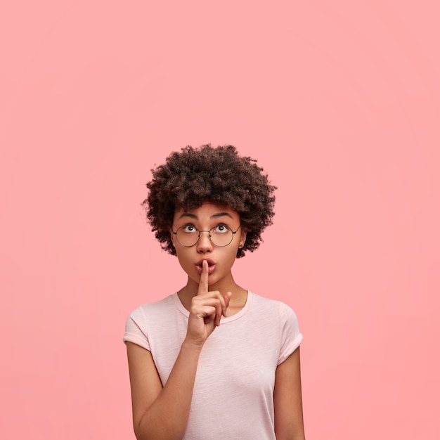 Young African-American woman wearing round glasses