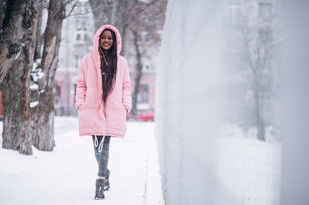 Young african american woman in winter outside in park