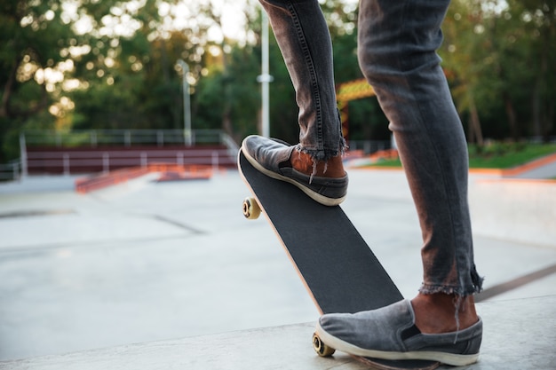 Young african man doing skateboarding