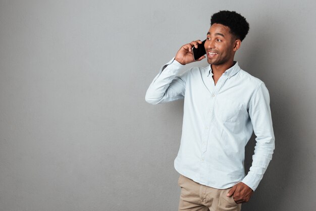 young african man speaking on mobile phone