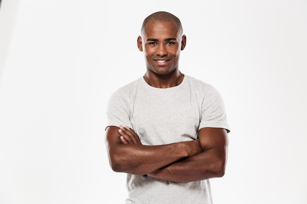 Young african man standing isolated