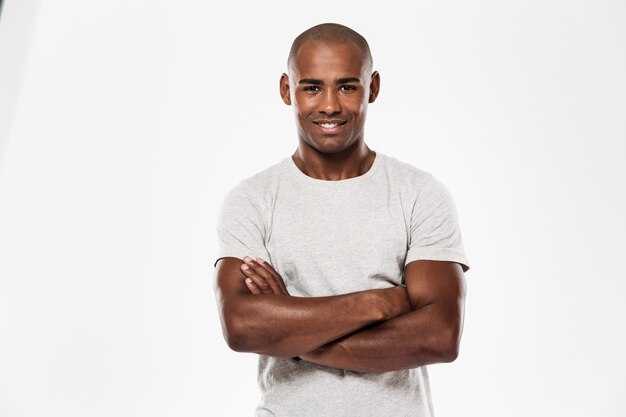 Young african man standing isolated