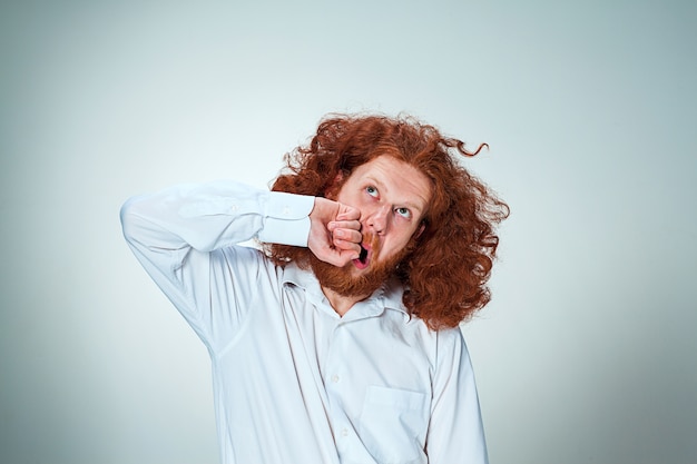 Free Photo The Young Angry Man With Long Red Hair Beating Himself Free Photo The Young Angry Man With Long Red Hair Beating Himself