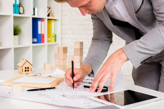 Young architect in his work room