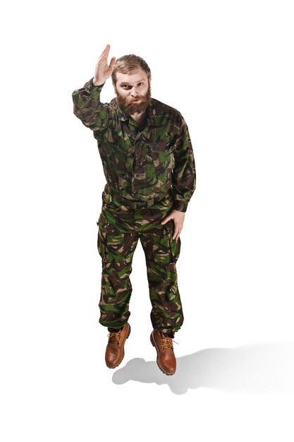 Young army soldier wearing camouflage uniform isolated on white