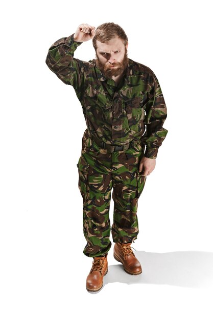 Young army soldier wearing camouflage uniform isolated on white
