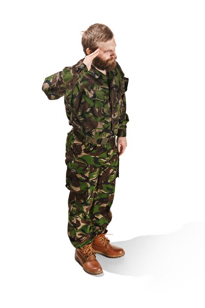 Young army soldier wearing camouflage uniform isolated on white