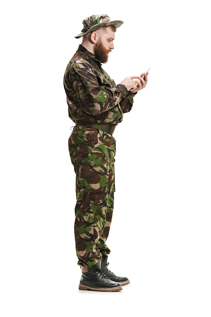 Free photo young army soldier wearing camouflage uniform isolated on white