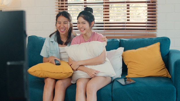 Young Asia Lesbian lgbtq women couple watching TV at home