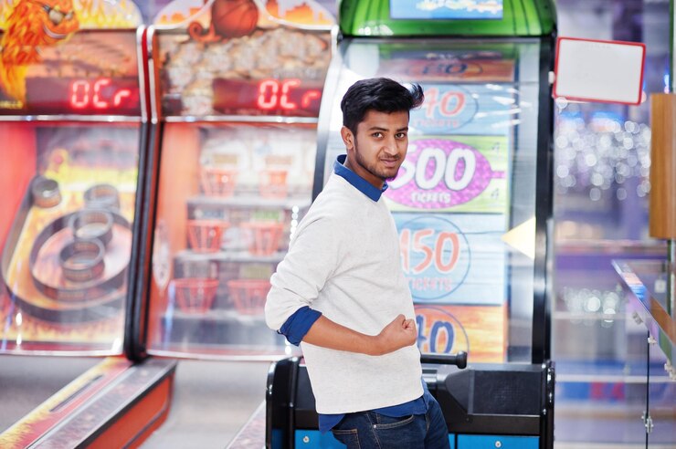 Young asian man play on fortune wheel slot machines to try win at lottery great prize Gamble jackpot prize spin Round drum casino money game